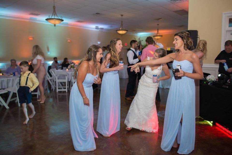 Bride and bridesmaids partying at the dance floor