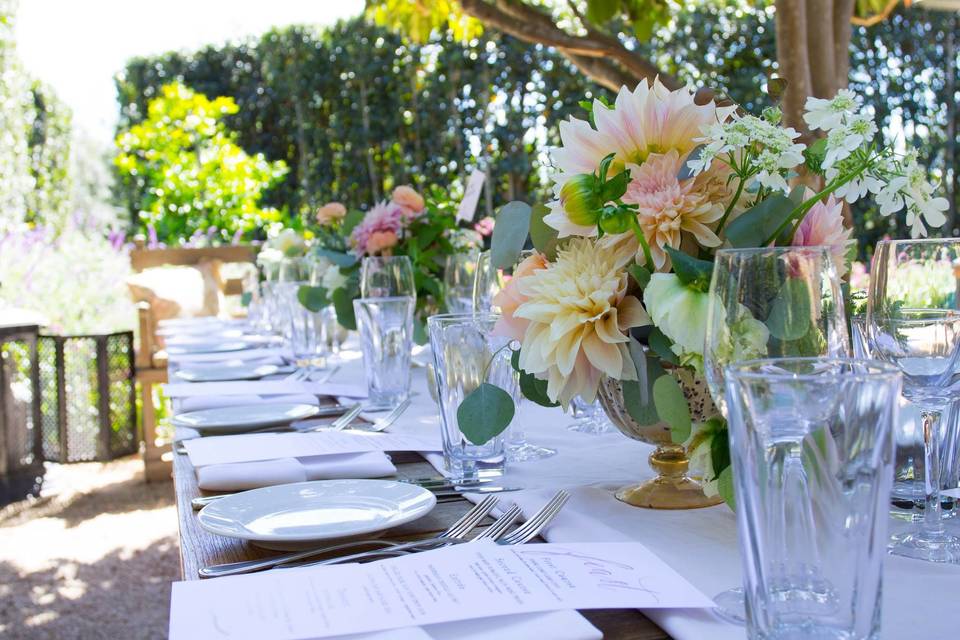 Long table setup with floral centerpiece