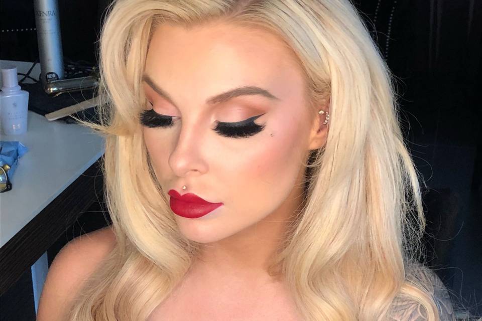 Strong eye makeup and bold red lip