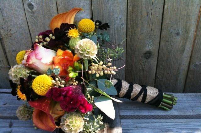 Autumn colors and textures add visual interest to this bouquet