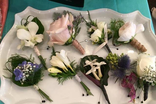 Boutonnières can be so interesting.  I love the details. These look like a box of candies!!