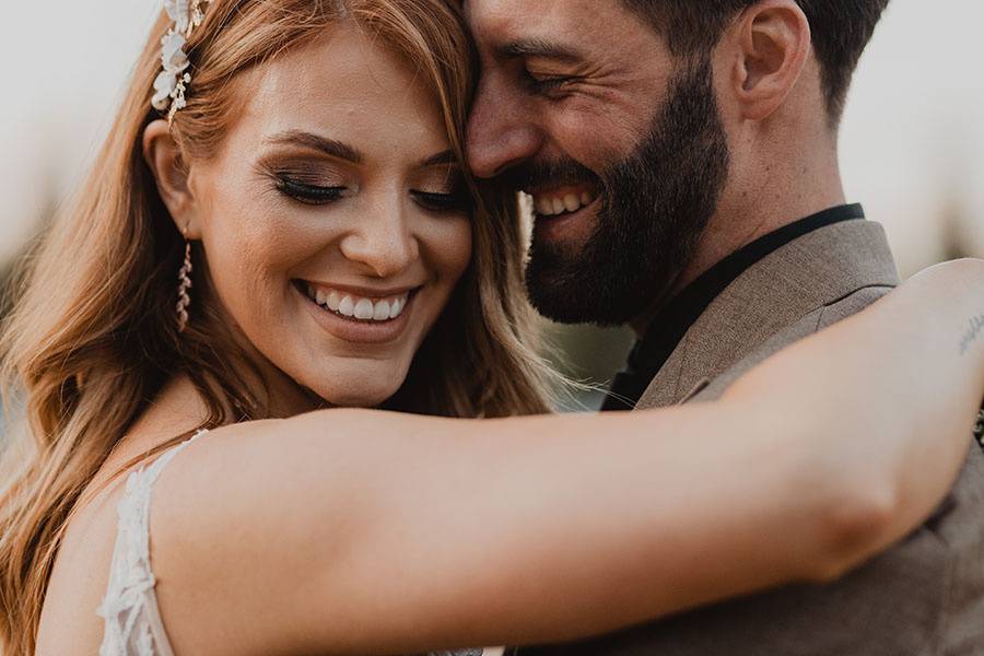 Bride holds her groom