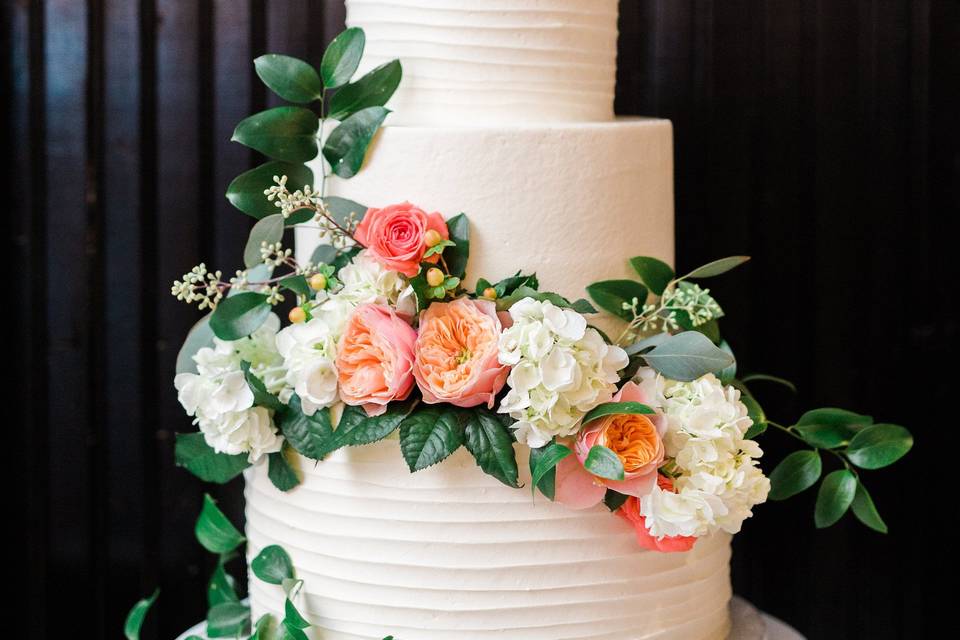 White wedding cake with flowers