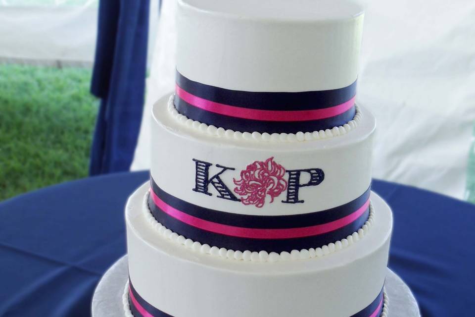 A monogram adorns this beautiful 3 tiered cake!