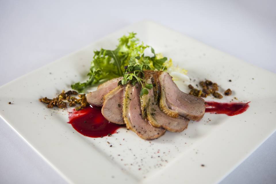 Seared duck breast with raspberry reduction