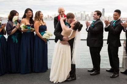 Happy officiant with the couple