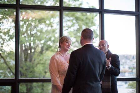 Officiant chatting with the newlyweds