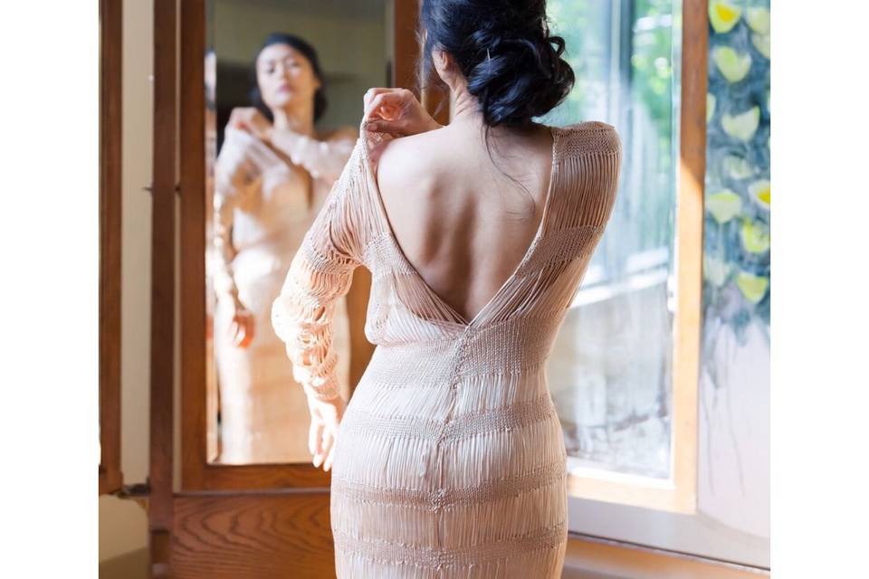 Kim on her wedding day. Kim is wearing custom made wedding gown in champagne color