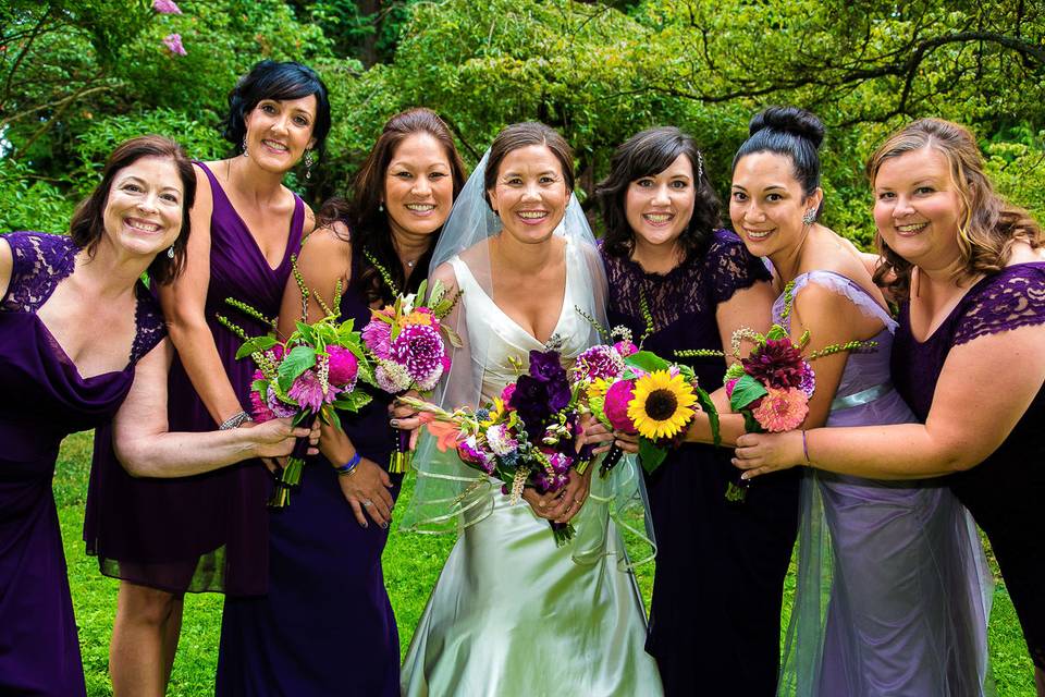Sarah's bridesmaids are wearing their custom jewelry gifts
