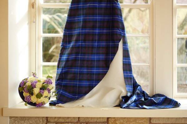 Silk tartan fabric perfect for the bride's dress. Available in over 60 Scottish tartans including the beautiful Pride of Scotland tartan pictured.