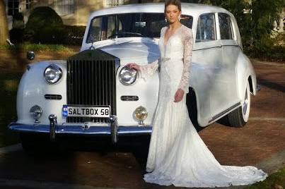 The bride besides the white car
