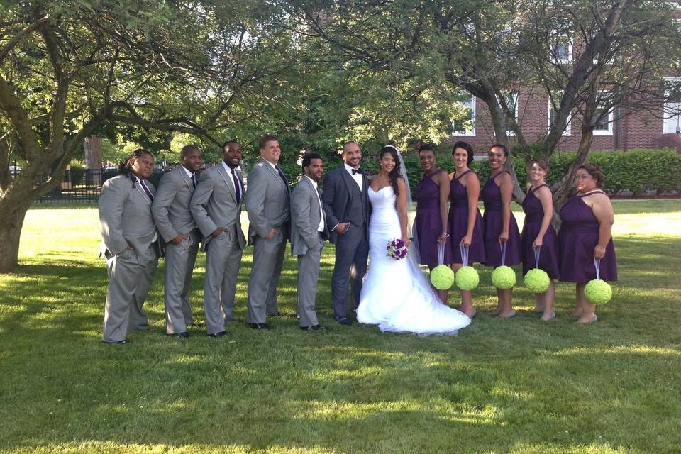 The couple with groomsmen and bridesmaids