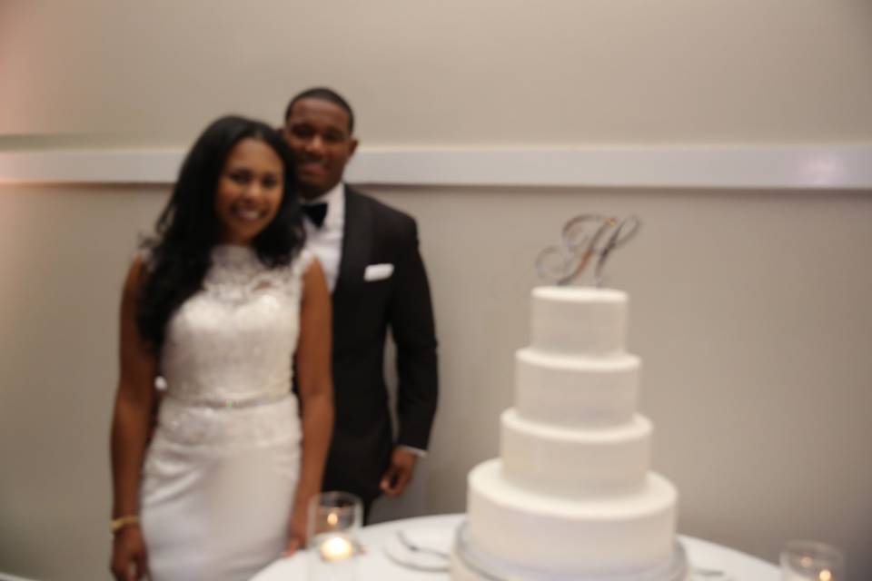 Bride and groom with the cake