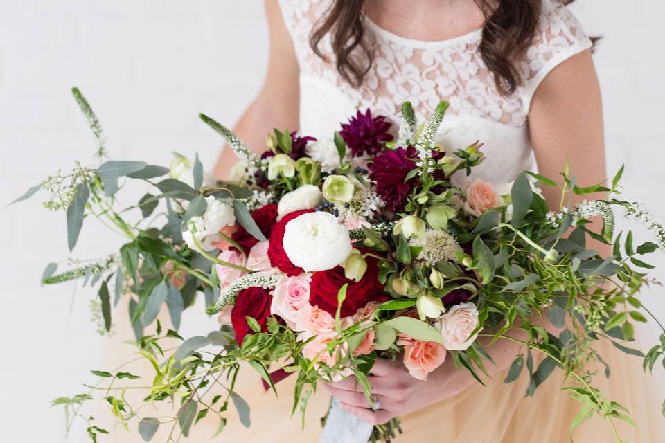 Bride holding the red roses