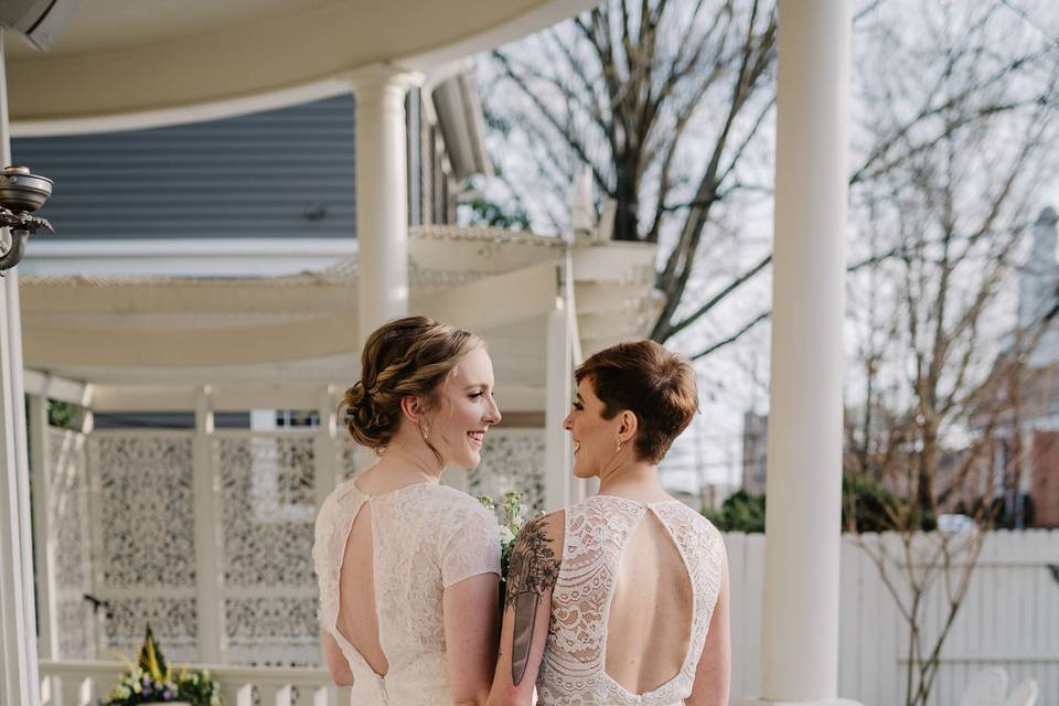 Brides together on veranda