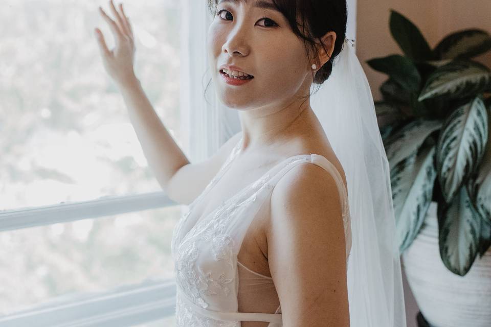 Bride by window