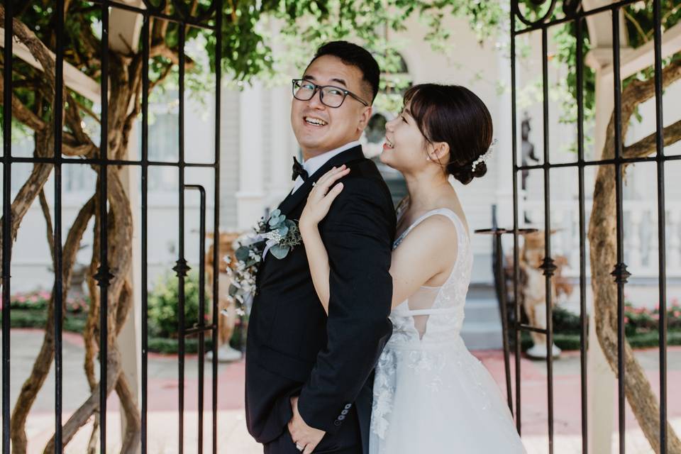 Bride and groom at front gate