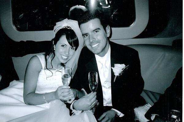 Bride and groom arriving in their limo