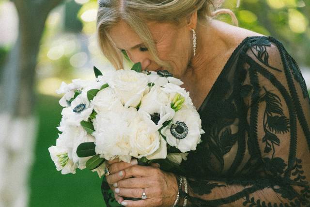 Bride smelling roses