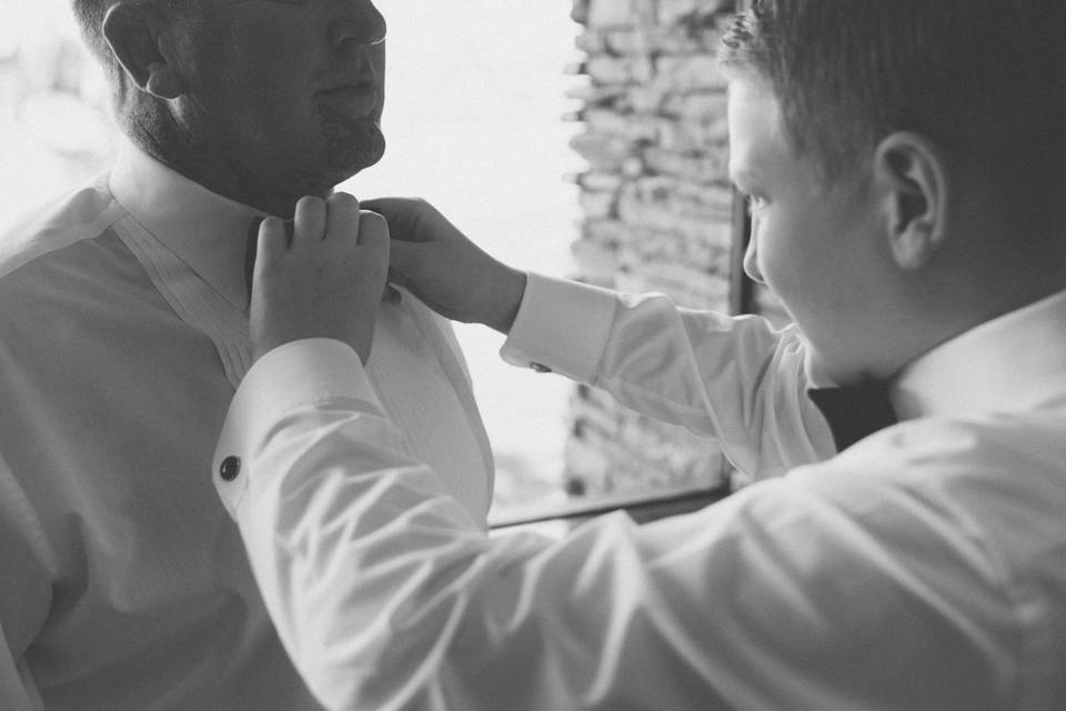 Son tying fathers bowtie