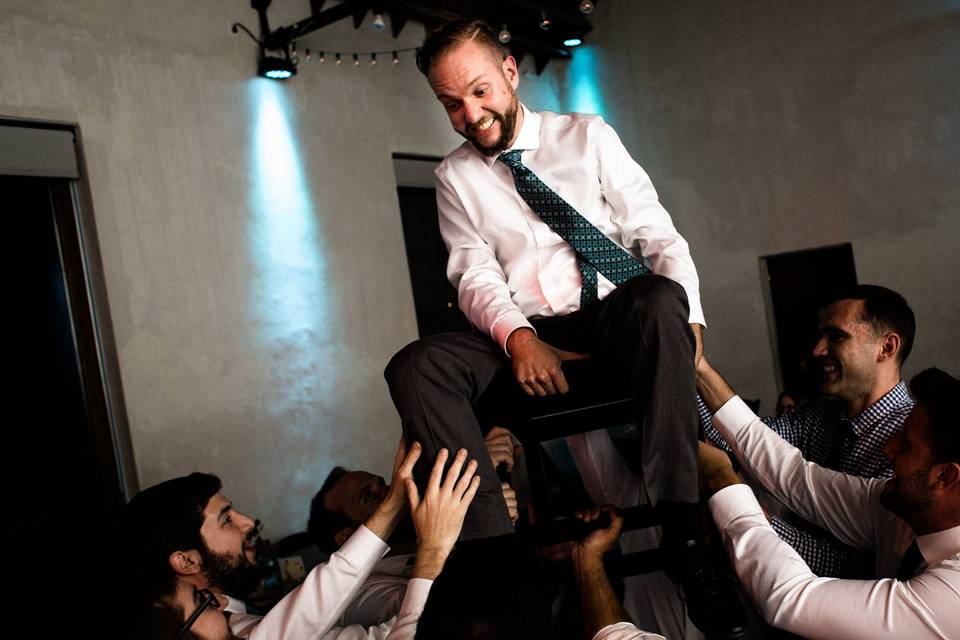 Groom up in the air - Arkansas Wedding Collection