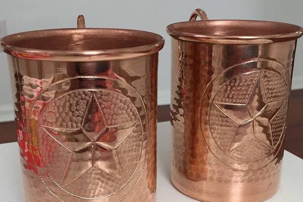 Handcrafted hammered pure copper Moscow Mule mugs. We can hand engrave names and your wedding date on these along with a special custom logo or Monogram.
This is our stock Texas star mug. We can work with you to create a custom design that represents you, your lifestyle, and your personality.