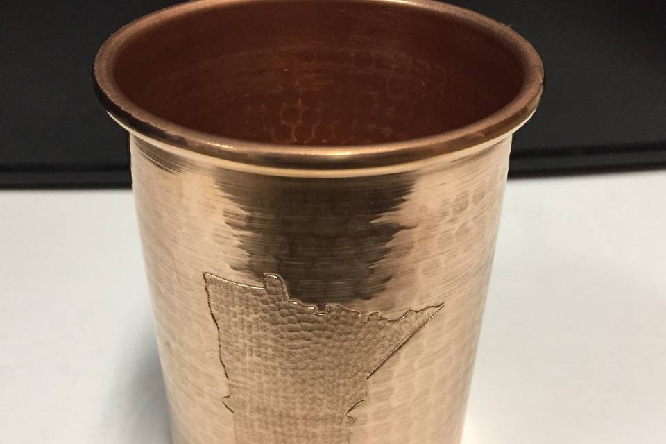 Colorado State Flag hand engraved Moscow Mule Mugs. Handcrafted, hammered pure copper. We offer sizes ranging from 10oz-24oz in a variety of shapes.  We can hand engrave your mugs to fit your wedding and vision.