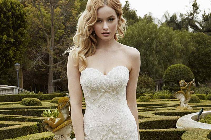 Style Islesboro <br> Full-length, modified A-line tulle gown featuring intricate corded lace bodice, romantic sweetheart neckline, and delicate pearl buttons above a center back zipper.