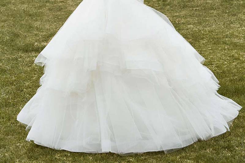 Style Ivan <br> Full-length mermaid gown features tiered horsehair layers over tulle mermaid skirt and soft tulle ruched bodice with romantic sweetheart neckline. Finished with center back zipper.