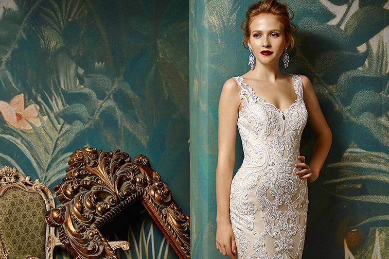 Jazzy	<br>	An absolute stunner. Stopping anyone in their tracks is easy in this gorgeous, full-length mermaid gown of exquisite Venice lace and tulle. A romantic sweetheart neckline is the perfect complement to a sultry low illusion back with crystal buttons along an invisible zipper - ensuring that your entrance will be just as showstopping as your exit.