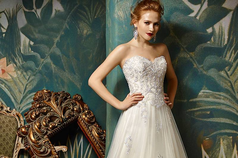 Jolanda	<br>	Soft, delicate, and romantic -- all the makings of a perfect bridal look are in this full-length, strapless A-line gown. A classic sweetheart neckline is gorgeous with beaded embroidered lace and an ethereal tulle skirt. An invisible back zipper completes the lovely look.