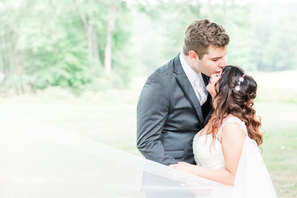 Bride and groom forehead kiss