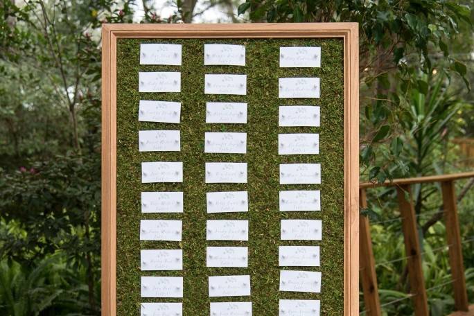 Harmony garden wedding style shoot | escort cards on moss