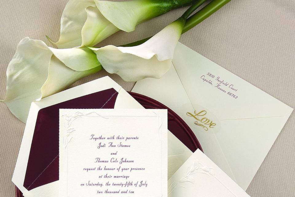 Red Roses Wedding Invitations - Two shimmery red foil roses with glossy black stems interlock above your names to beautifully close this natural white z-fold invitation.  Folded size: 6 5/8