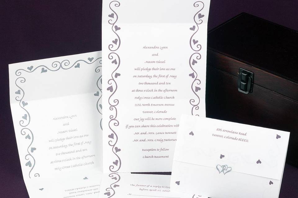 Love Struck Wedding Invitations - Silver-embossed hearts sweetly highlight your names at the top of this non-folding bright white invitation. Your wording is showcased beneath the design for a heartfelt introduction to your special day.  Card Size: 5