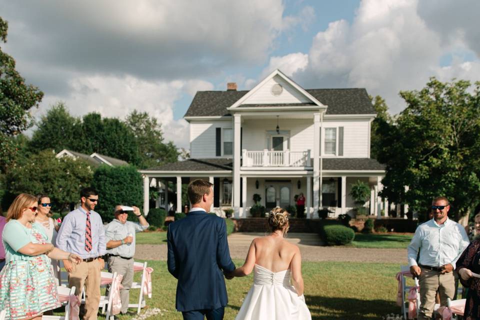 The bride and groom walk away