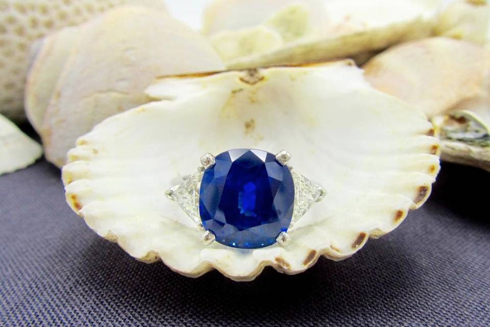 Estate 6+ carat blue sapphire and diamond three stone engagement ring set in platinum.