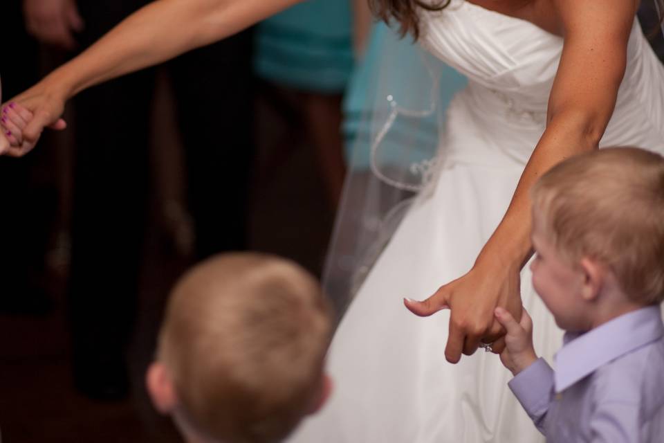 Bride dancing with kids