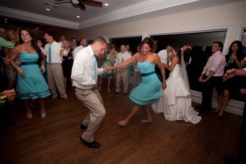 Couple and guests dancing