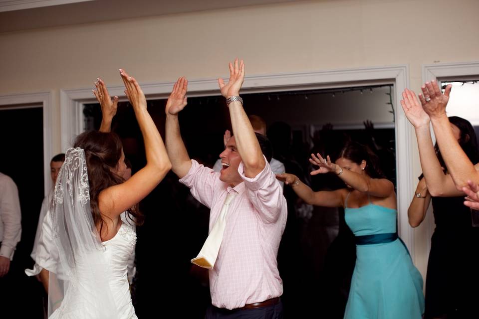 Couple and guests dancing