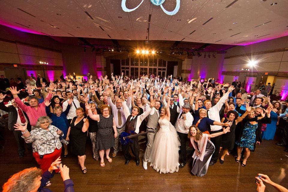 Dancing couple and guests