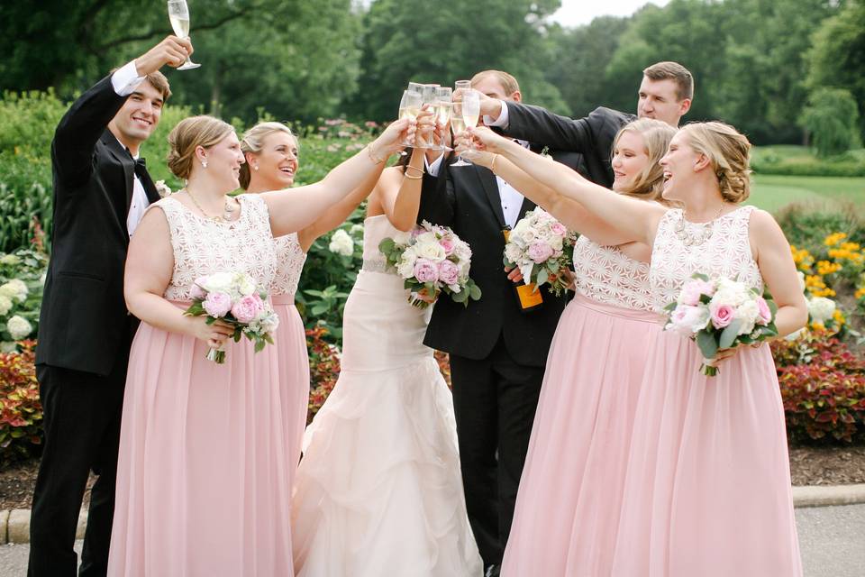 The couple with the bridesmaids and groomsmen