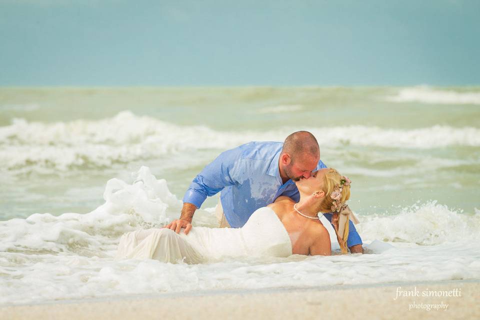 Newlywed couple at the beach