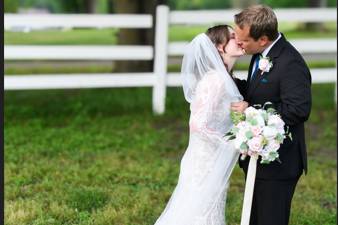 Bride and groom kiss