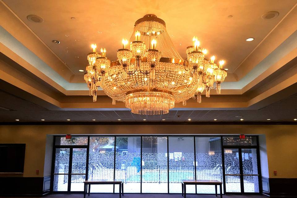 Chandelier in our Grand Atrium with great natural lighting and a view of the pool!