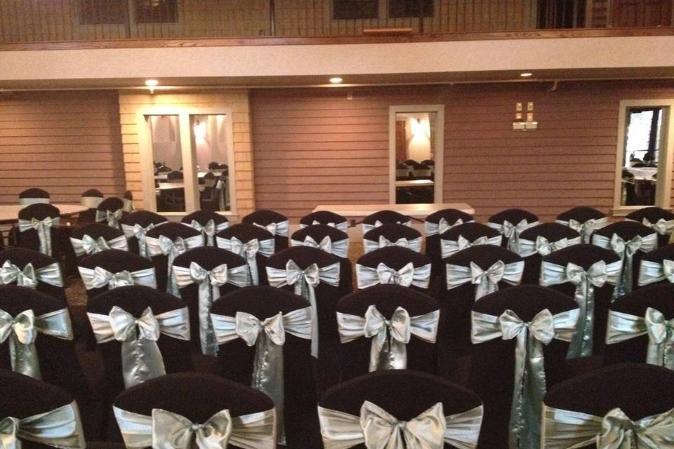 Sage Sash Bow Tie on Black Spandex Chair Cover at Courtyard at the Docks Toledo, OH www.NewChairDo.com