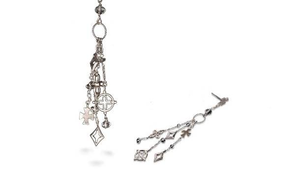 A mix of crosses that dangle with a little touch of white topaz quartz crystal briolettes in three varying lengths to add that light touch of sparkle. Smooth and textured metals add contrast.
Set in 14K White Gold with a textured silver ring
White Topaz Quartz (2.68 cts)