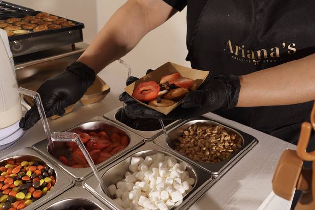 Putting toppings on pancakes