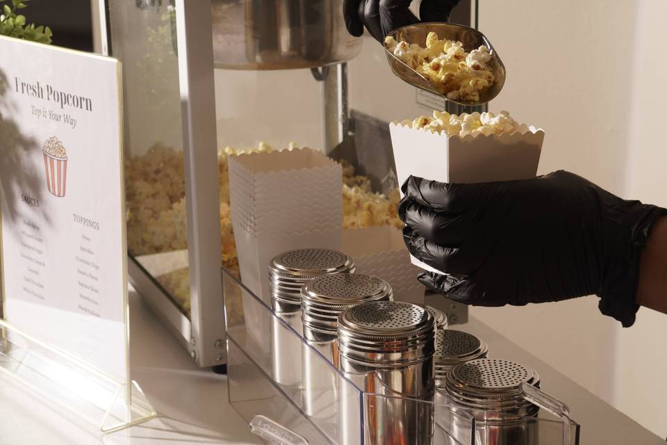 Pouring popcorn into a box