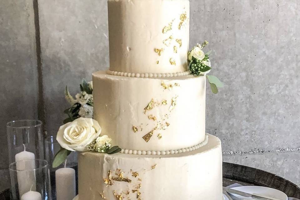 Tiered cake with gold leaf